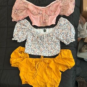 Corset style crop tops. Never worn. Selling all 3 together.